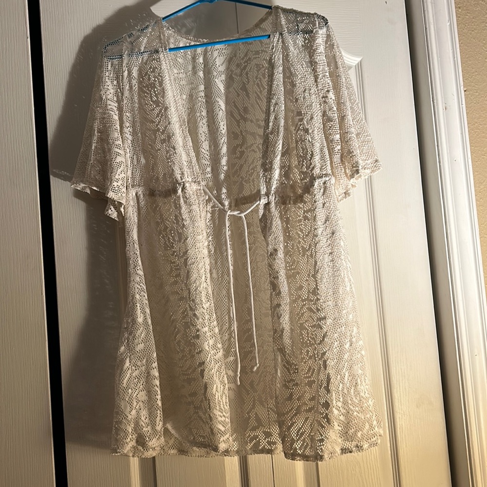 All white crochet swimsuit cover up.